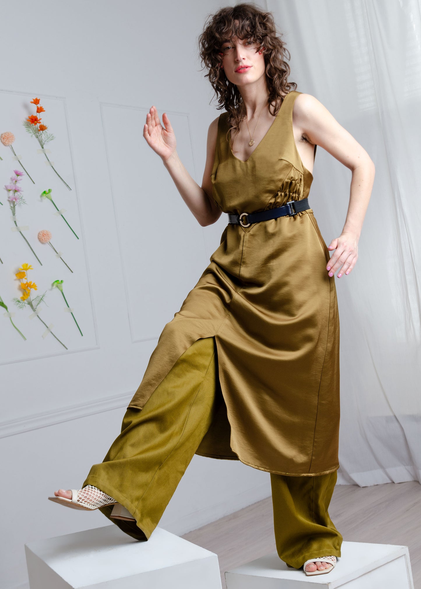 Form skimming Midi length A-line dress with gathered side panels and very low back. Khaki  green satin fabric